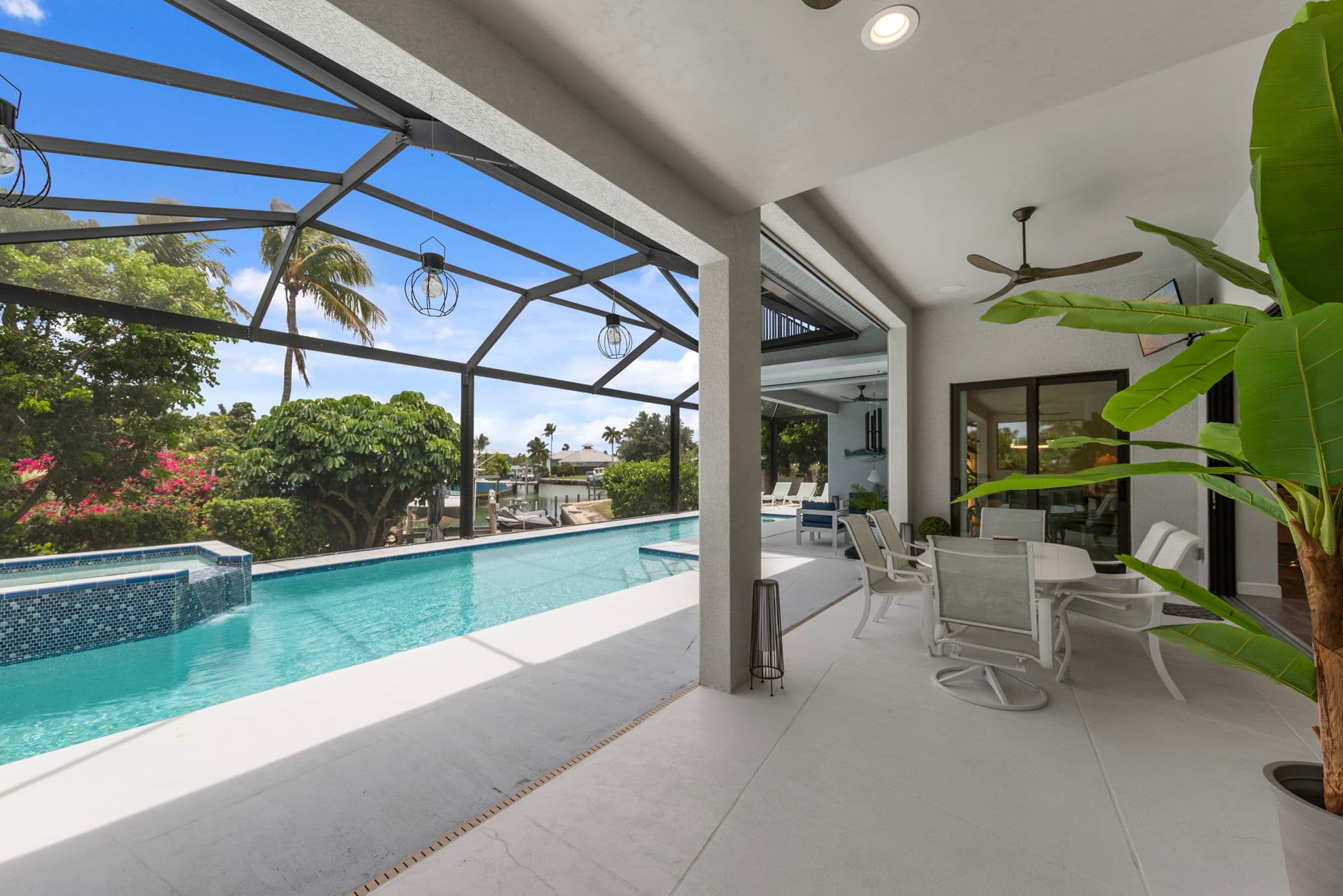 1066 Ruppert Rd Marco Island — rear exterior with pool and spa